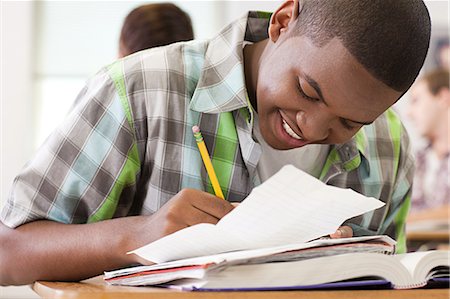 614-03552009
© Masterfile Royalty-Free
Model Release: Yes
Property Release: Yes
Male high school student working in classroom